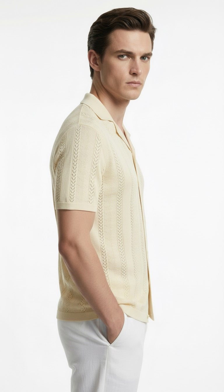 Man wearing a light-colored short-sleeve shirt and white pants on a white background