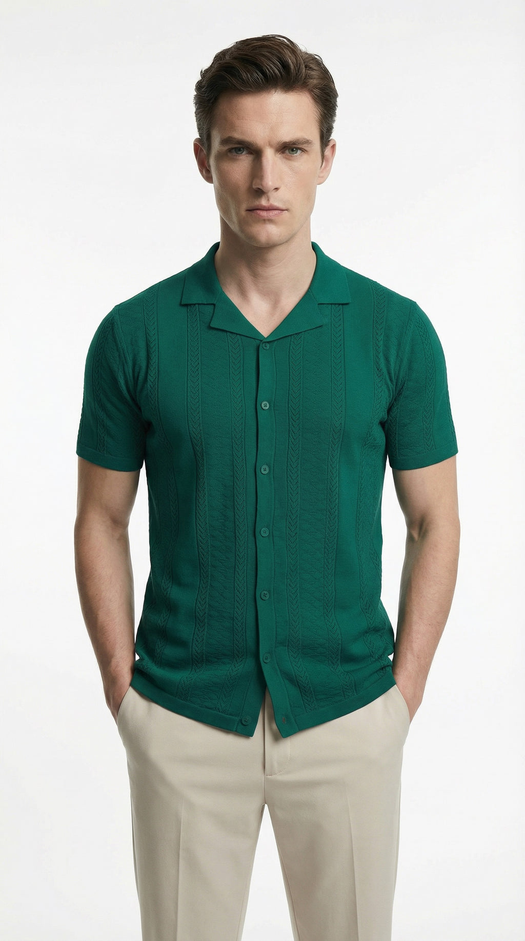 Man wearing a green short-sleeve shirt and beige pants on a white background