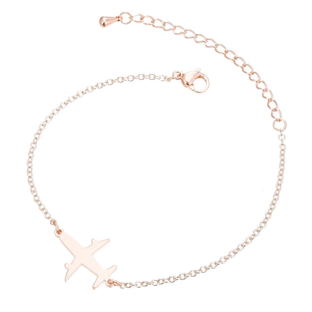 Gold Unique Aircraft Bracelet with aviation-themed charms for aviation enthusiasts Meléche Jewelry USA 