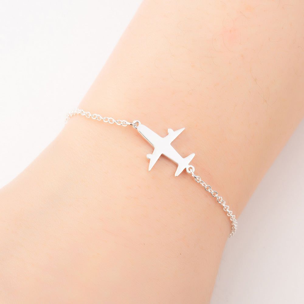 Silver Unique Aircraft Bracelet with aviation-themed charms for aviation enthusiasts Meléche Jewelry USA 