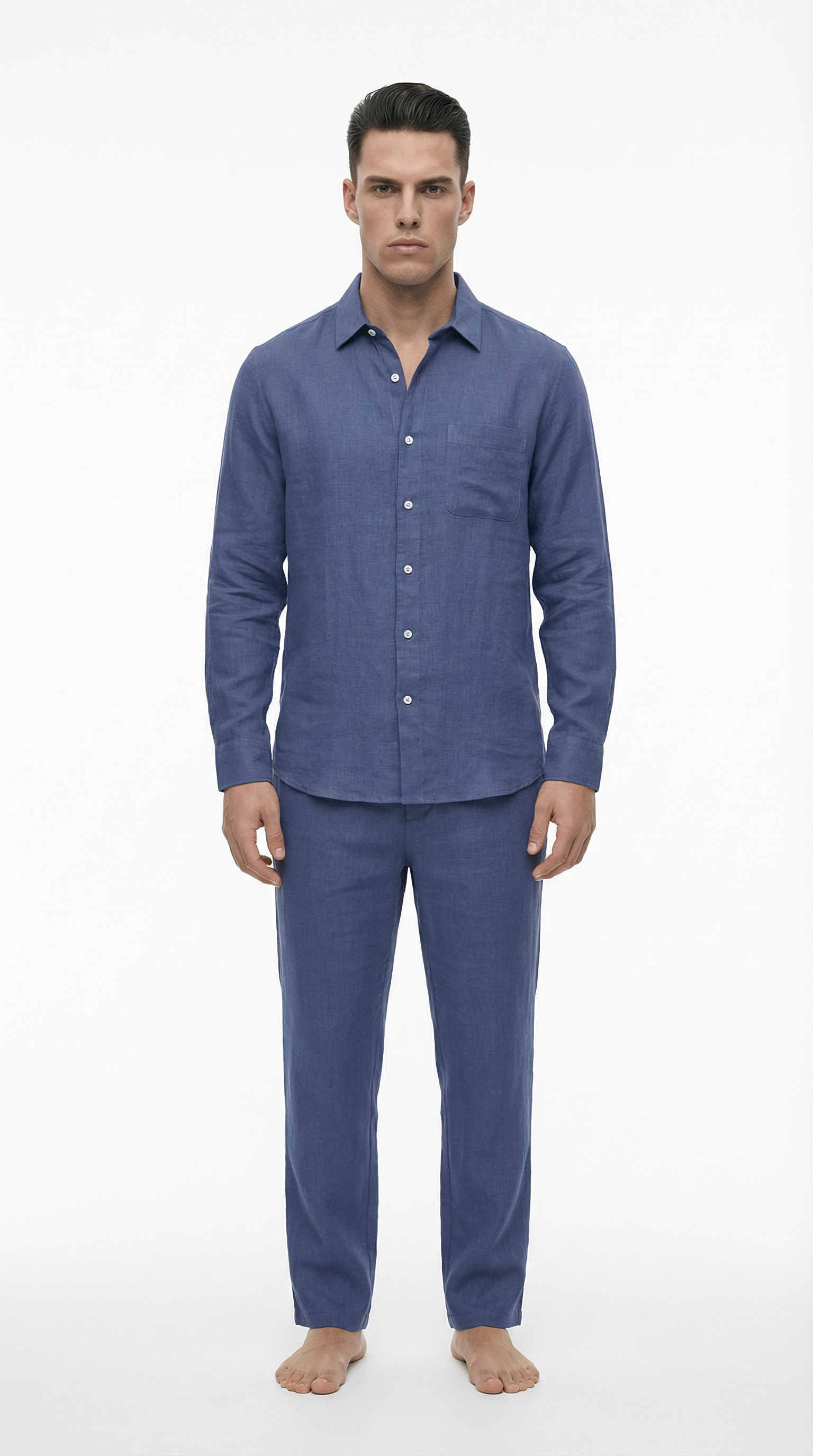 Man wearing a blue pajama set on a white background
