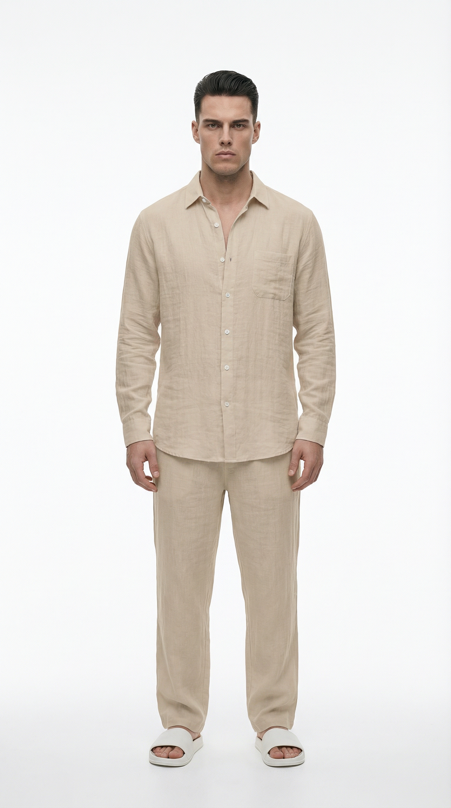 Man wearing a beige linen shirt and pants on a white background