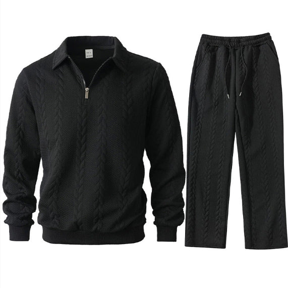 Black quilted jacket and pants set on a white background