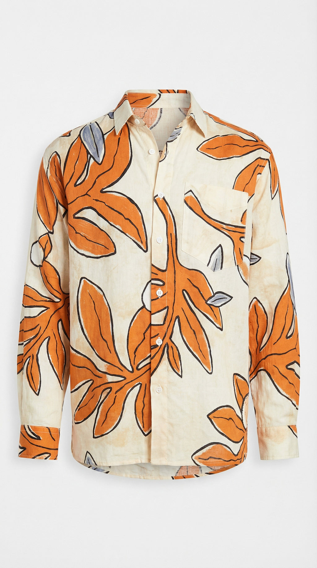 Person wearing a patterned shirt with orange leaves indoors.