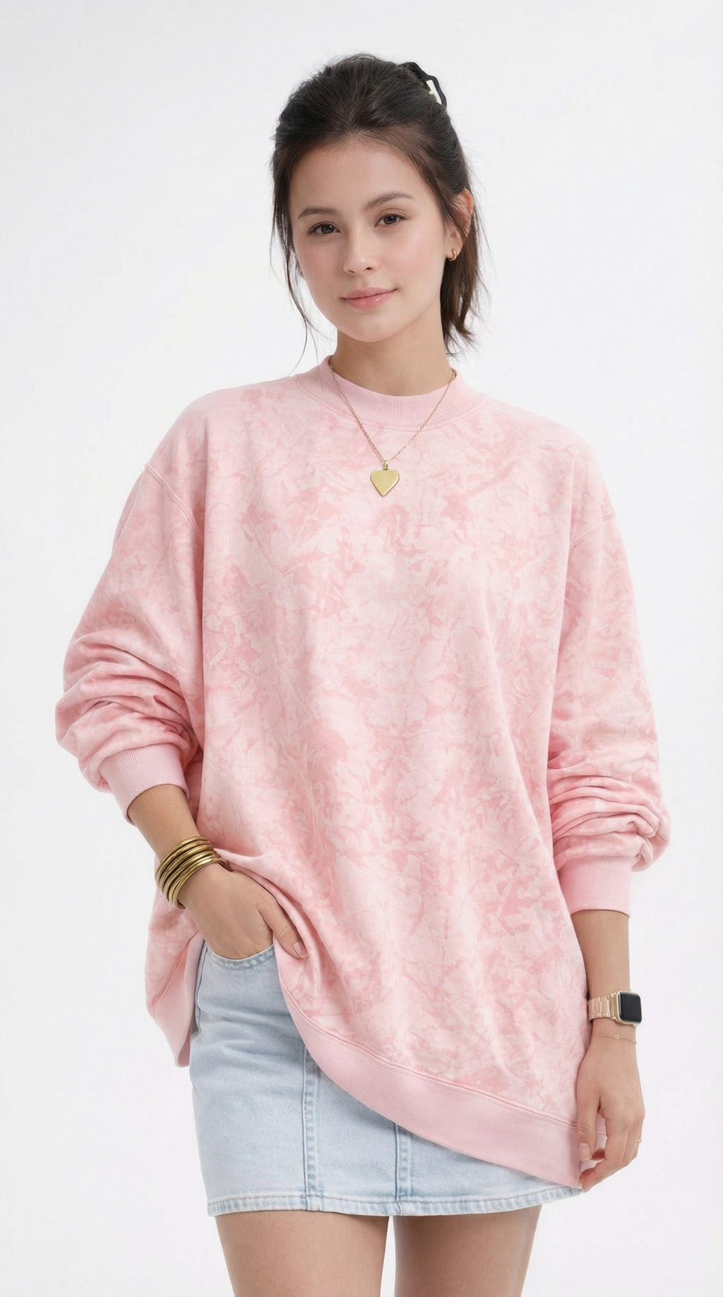 women wearing a pink tie-dye sweatshirt and denim skirt from Meleche or Meléche (short as (Mé))