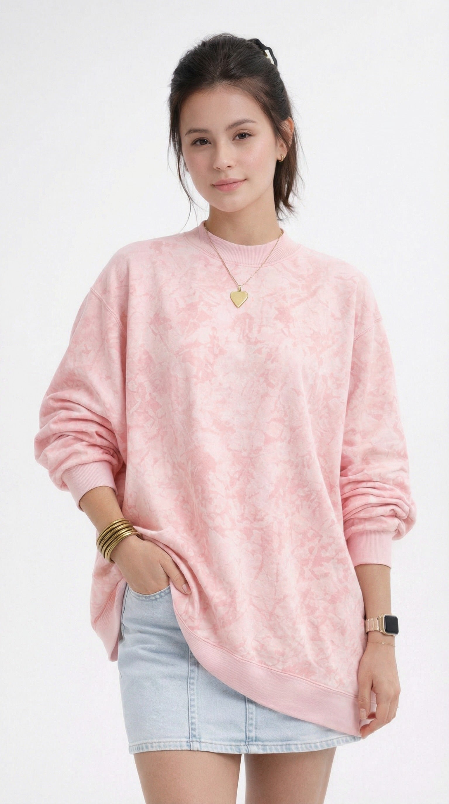 women wearing a pink tie-dye sweatshirt and denim skirt from Meleche or Meléche (short as (Mé))
