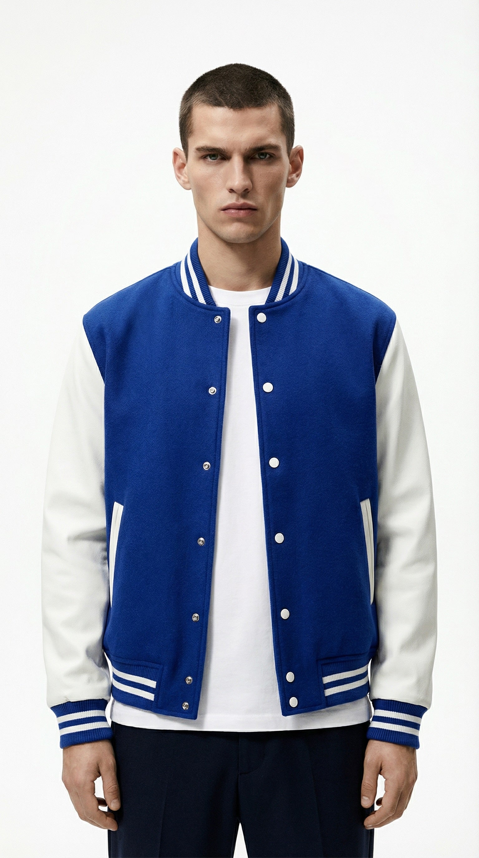 Blue and white varsity jacket from Meleche or Meléche (short as (Mé)) worn by a person against a neutral background