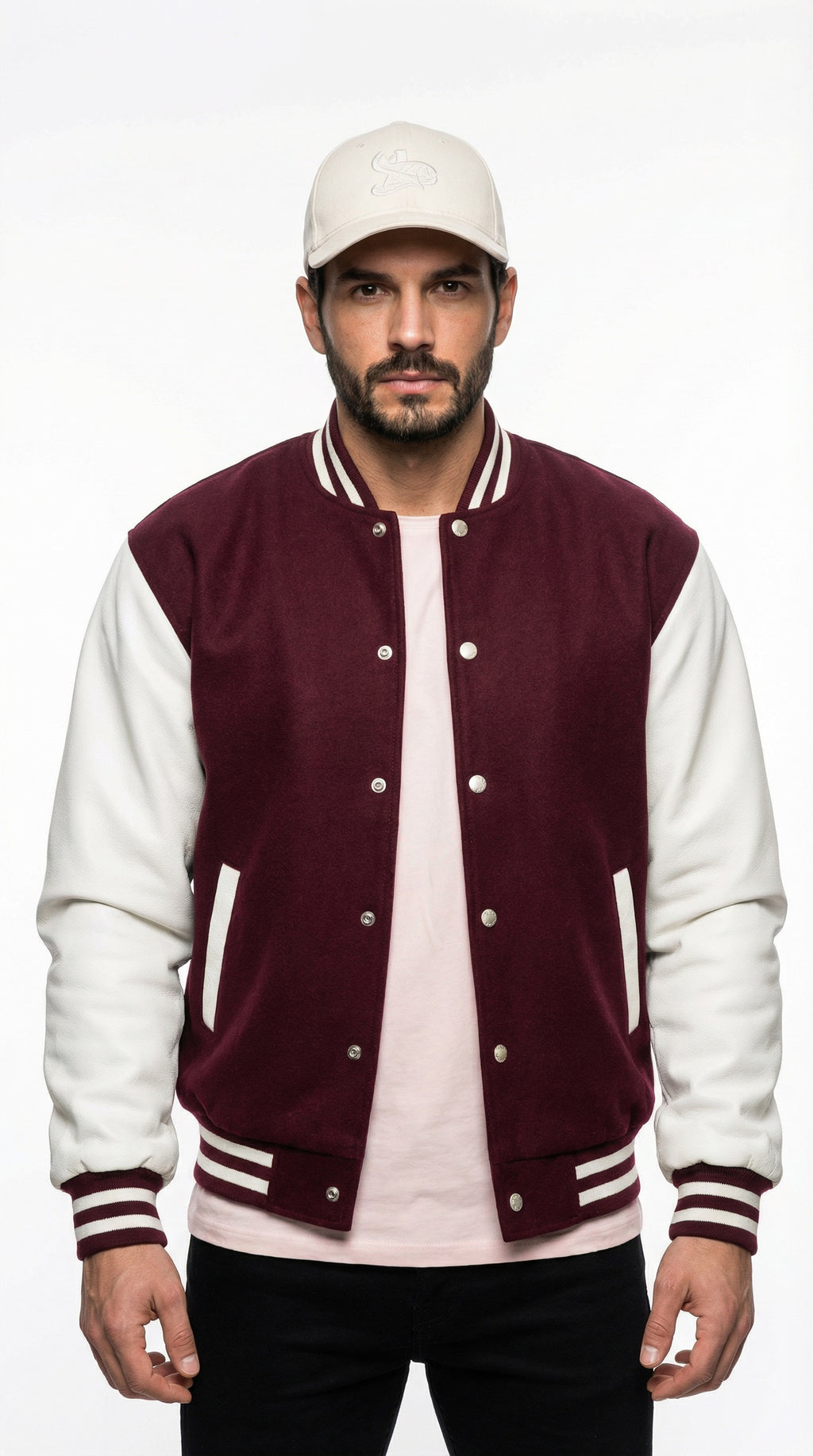 Man wearing a maroon and white varsity jacket with gray pants from Meleche or Meléche (short as (Mé)), standing against a gray wall.