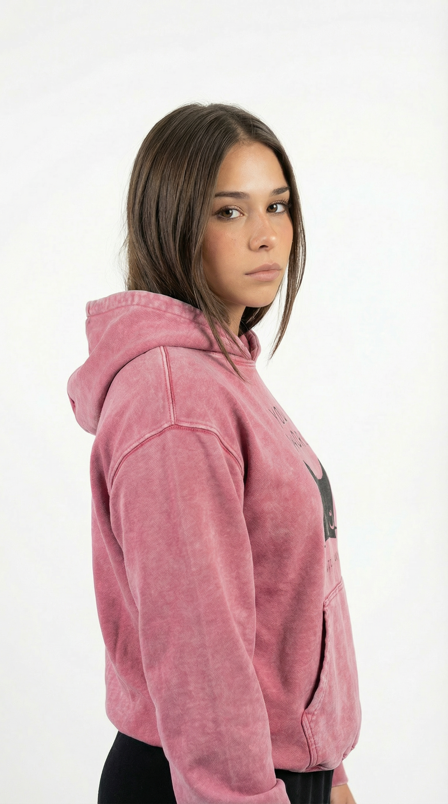 Person wearing a pink hoodie on a white background