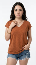 A woman modeling a short-sleeve V-neck t-shirt in a heathered burnt orange color, paired with distressed denim shorts, against a plain white studio background, from Meleche Fashion USA or Meléche (short as (Mé))