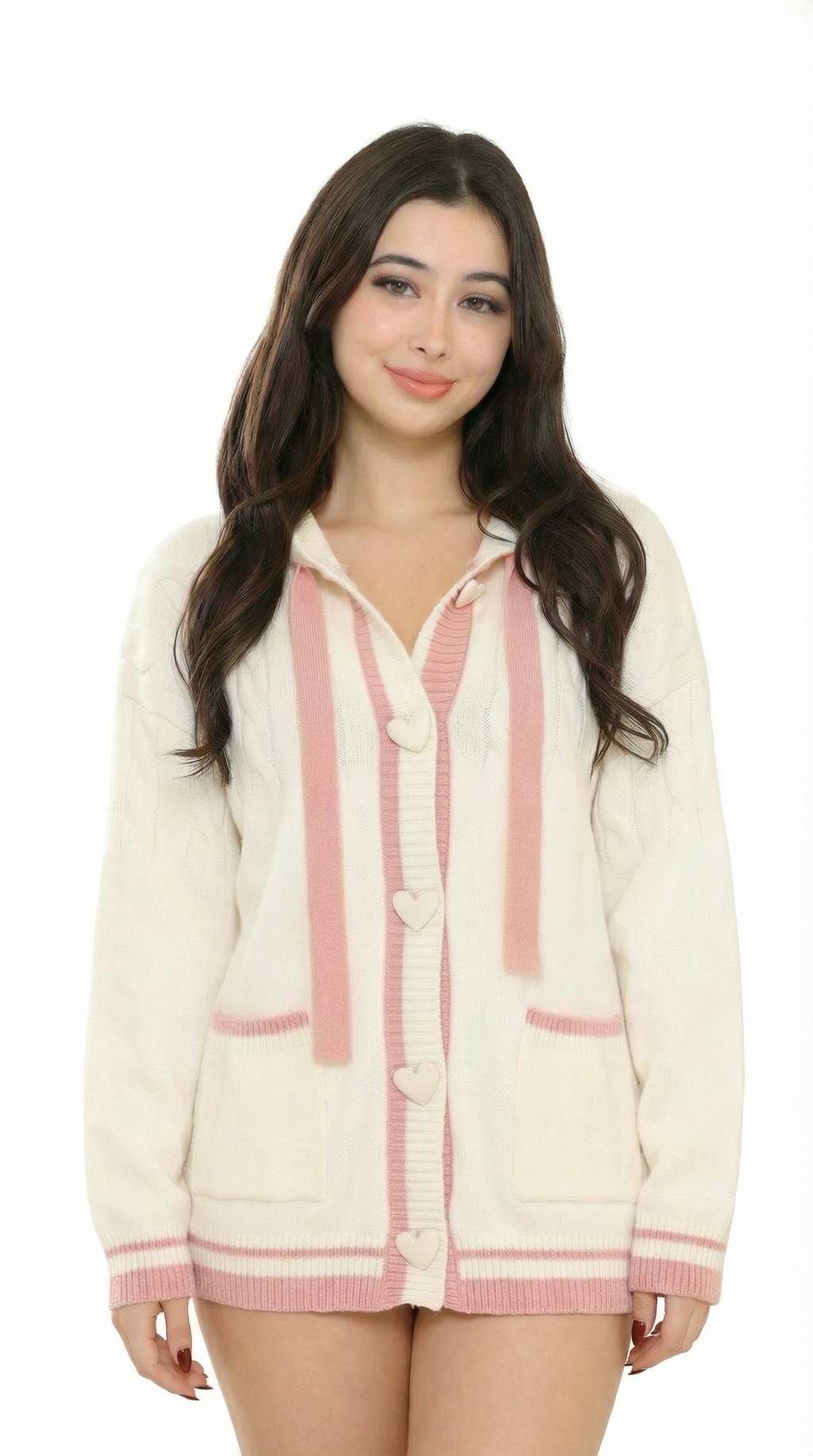 Women wearing a cream cardigan with pink trim from Meleche or Meléche (short as (Mé)) on a white background