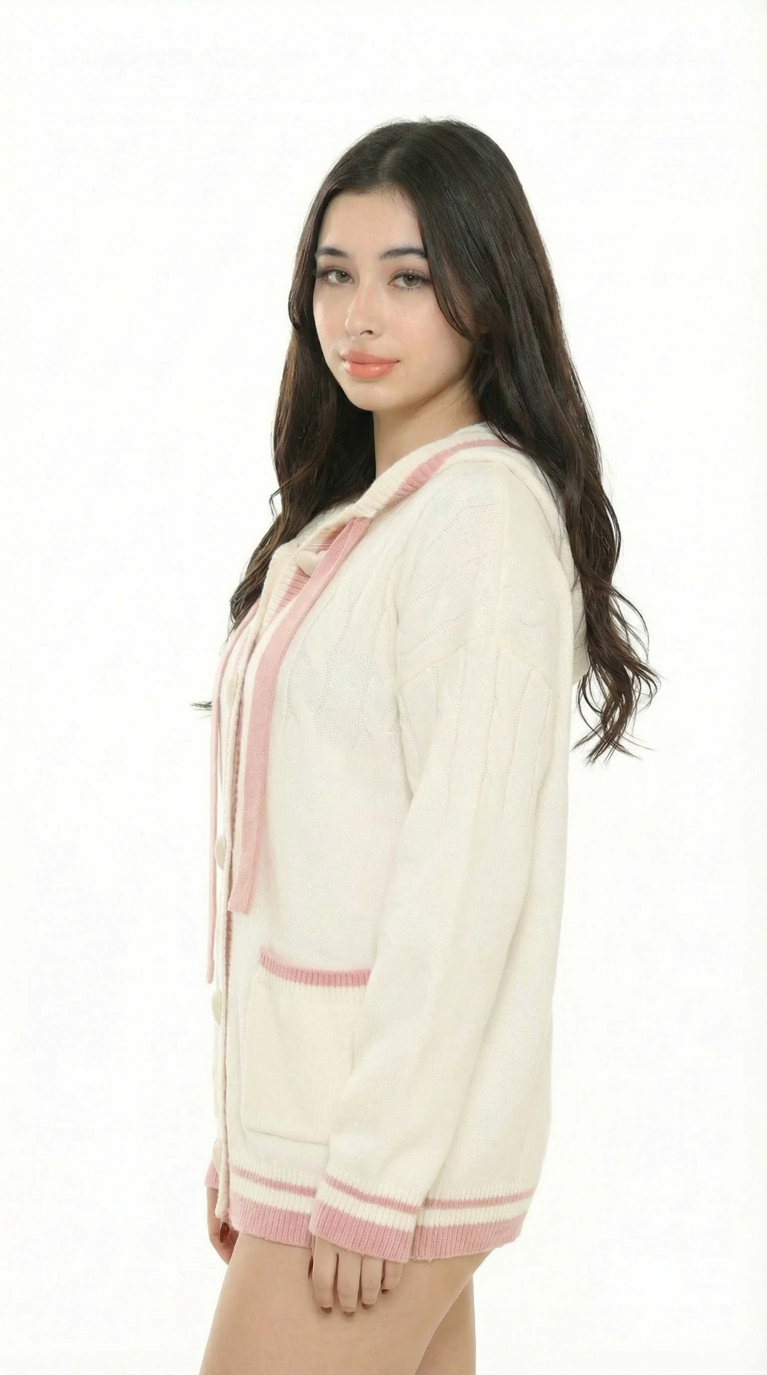Women wearing a cream cardigan with  sexy pink trim from Meleche or Meléche (short as (Mé)) on a white background