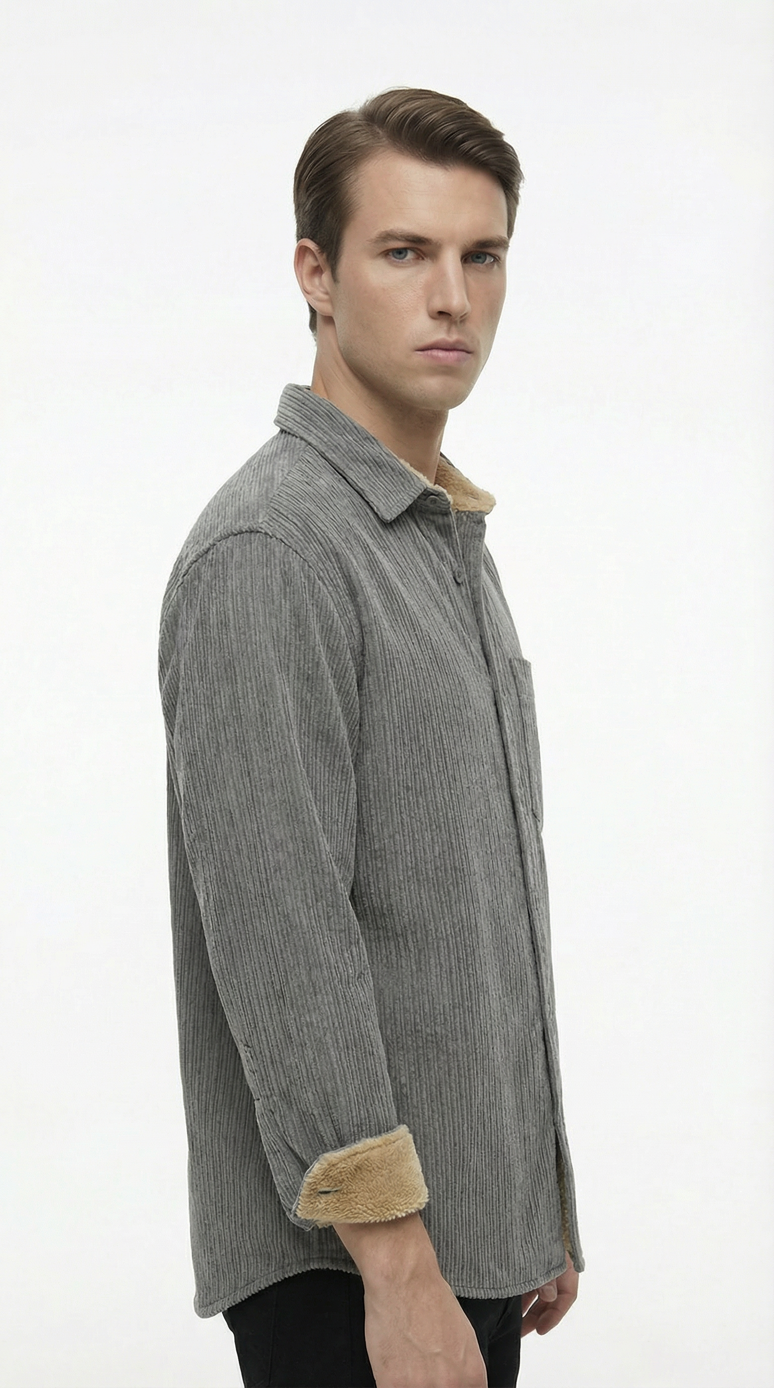 Man wearing a gray shirt with brown trim on a white background