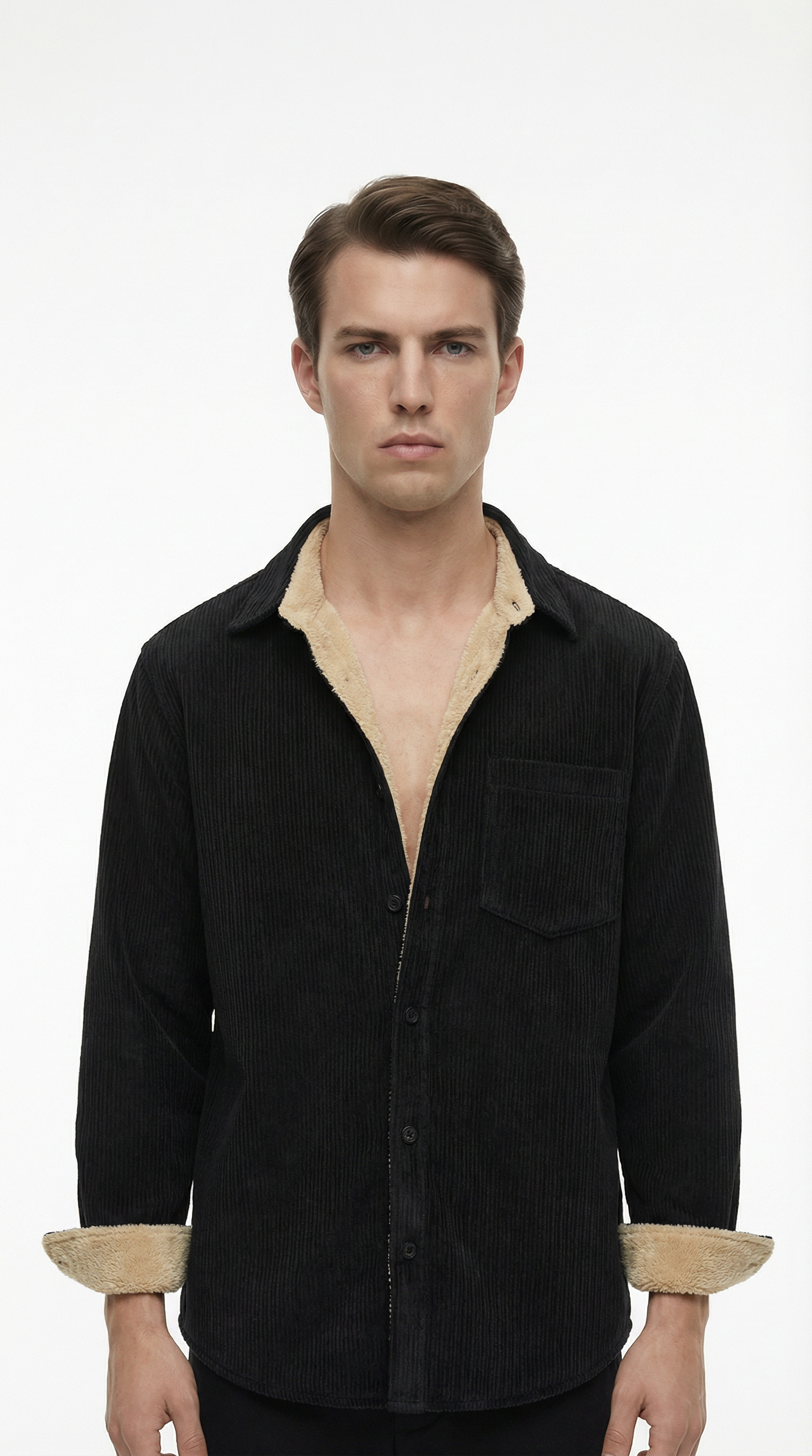 Man wearing a black shirt with beige trim on a white background