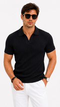 A man wearing a black short-sleeve ribbed knit polo shirt and white trousers, styled with black sunglasses, bracelets, and a watch, against a plain white background, from Meleche Fashion USA or Meléche (short as (Mé))