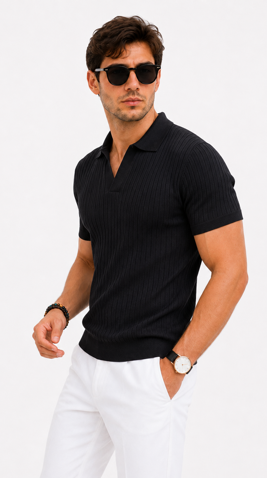 A man wearing a black short-sleeve ribbed polo shirt and white trousers, styled with black sunglasses, a black beaded bracelet, and a watch with a light-colored face, set against a plain white studio background, from Meleche Fashion USA or Meléche (short as (Mé))
