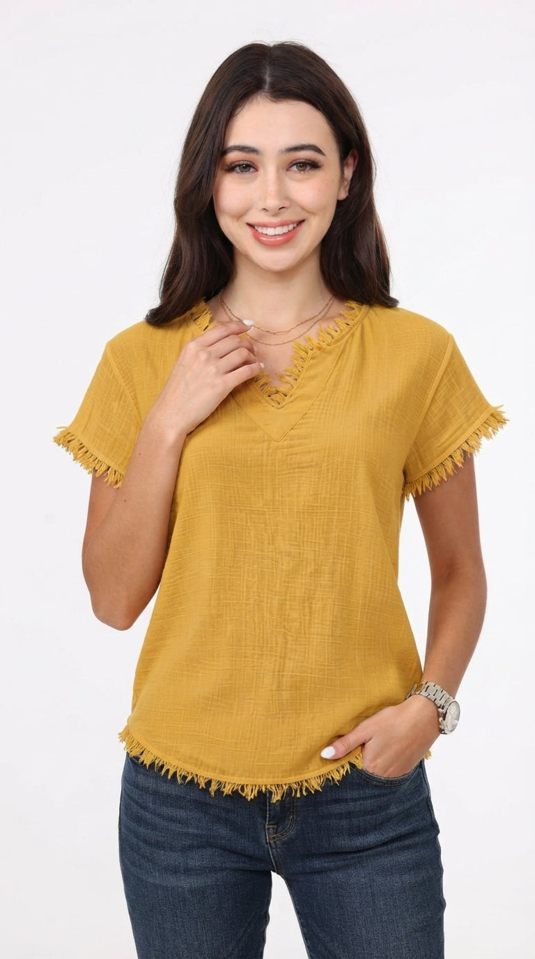 A woman modeling a mustard yellow short-sleeve top with frayed edges and a split neckline, paired with dark blue jeans, against a plain white background, from Meleche Fashion USA or Meléche (short as (Mé))