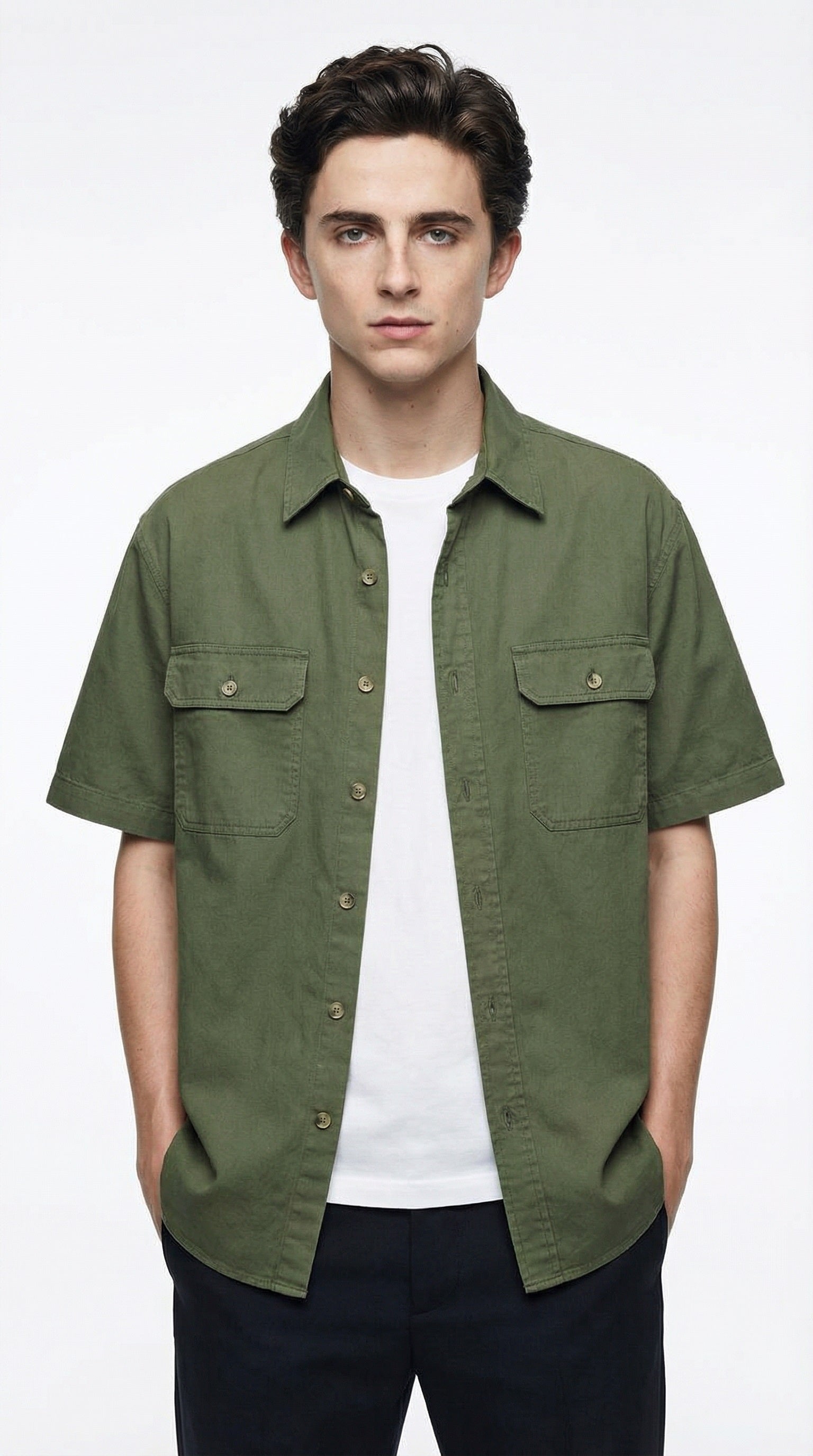 Green short-sleeve shirt over a white t-shirt on a gray background