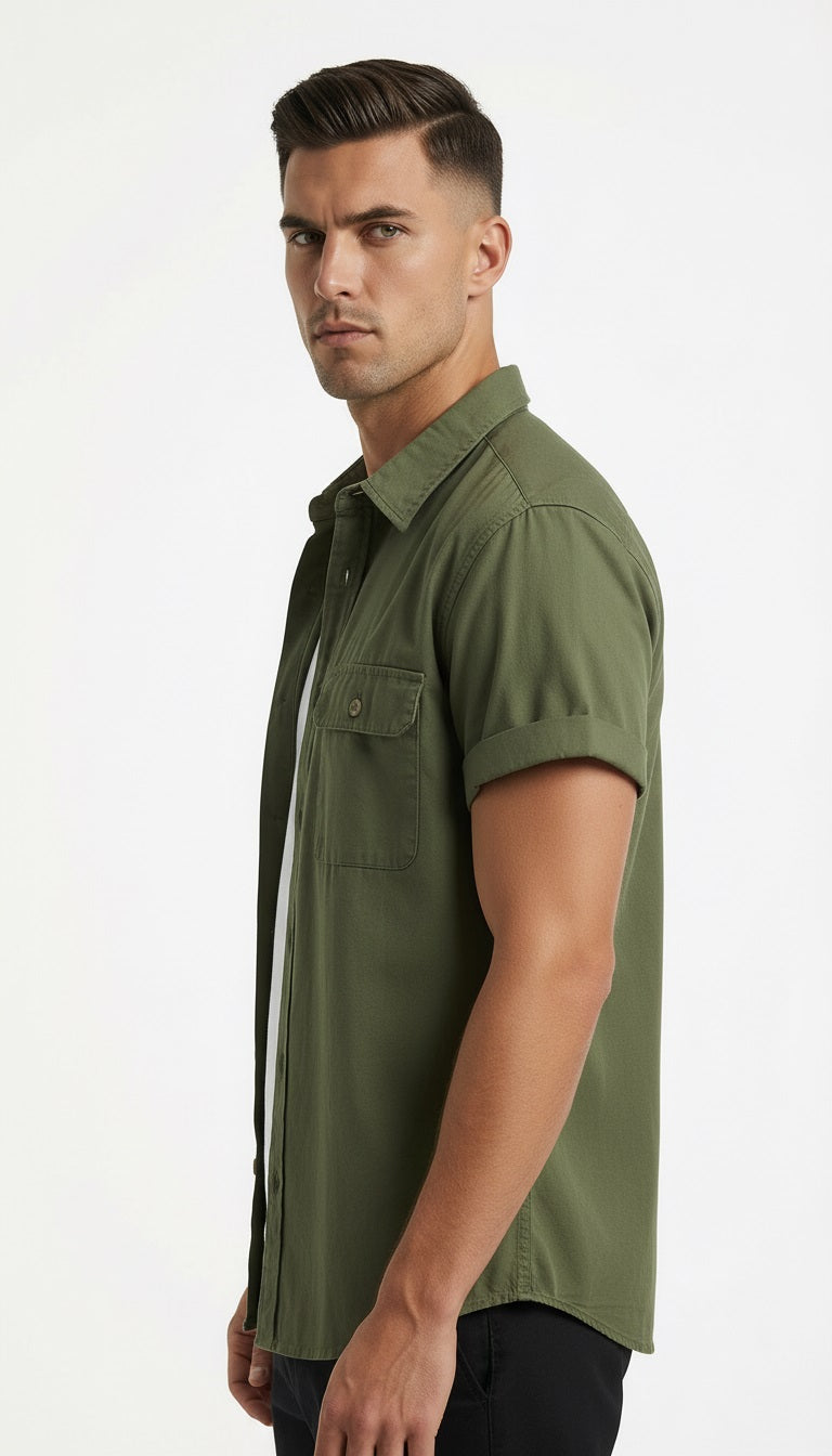 Green short-sleeve shirt over a white t-shirt on a gray background