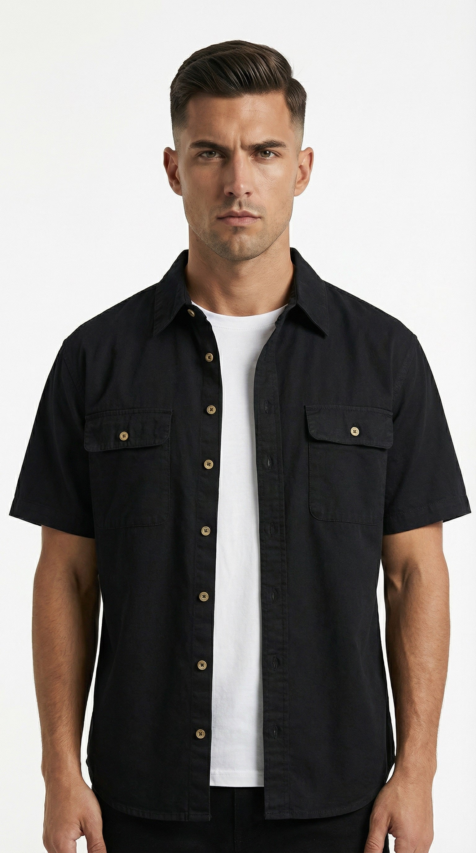 Black short-sleeve shirt with gold buttons on a wooden hanger against a gray background