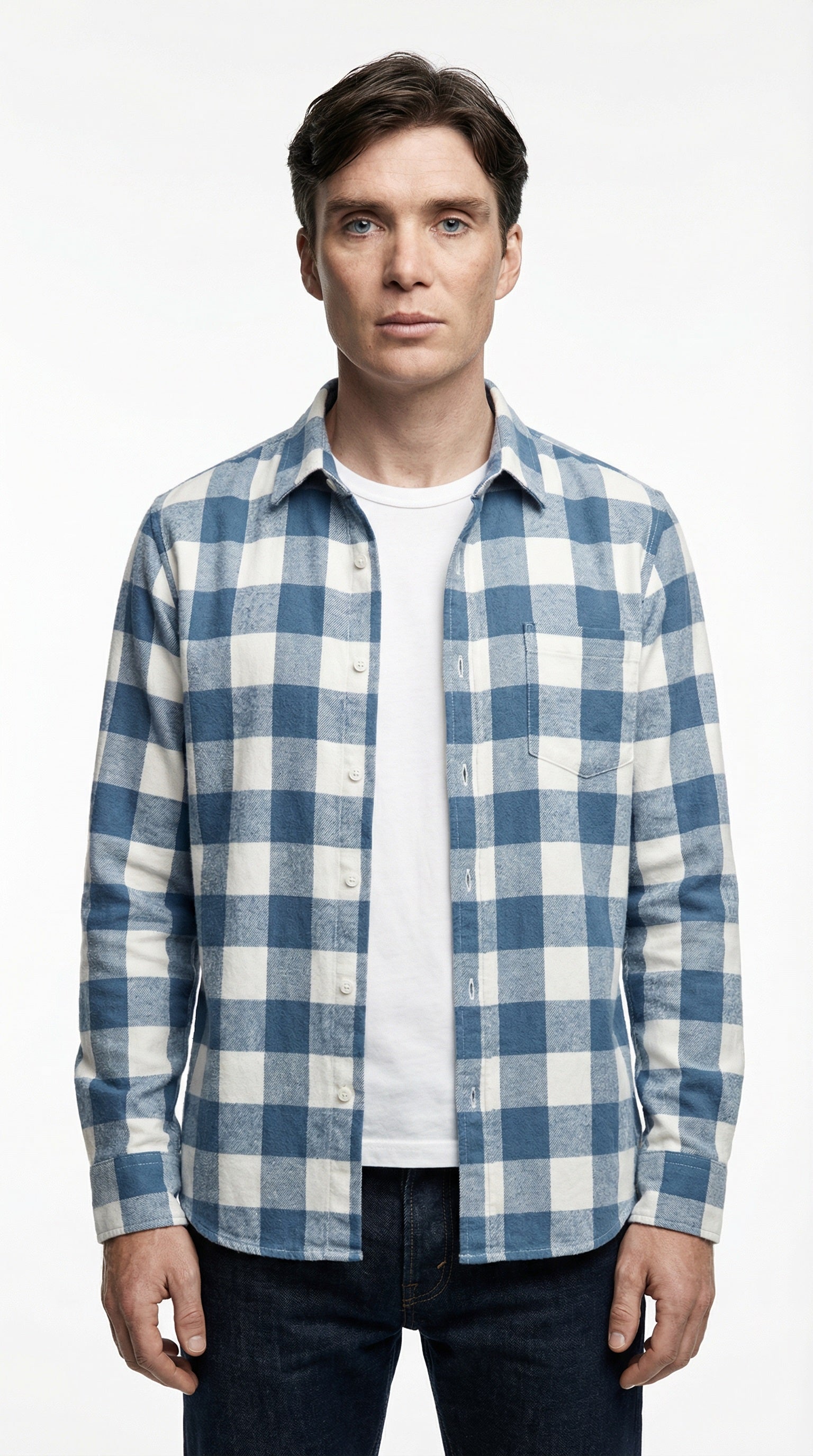 Blue and white checkered shirt on a wooden hanger against a gray background