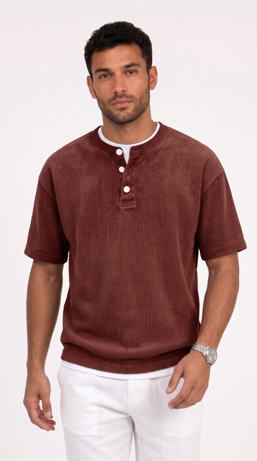 A man wearing a short-sleeve ribbed henley shirt in a deep reddish-brown color, paired with white pants, standing against a plain white studio background, from Meleche Fashion USA or Meléche (short as (Mé))