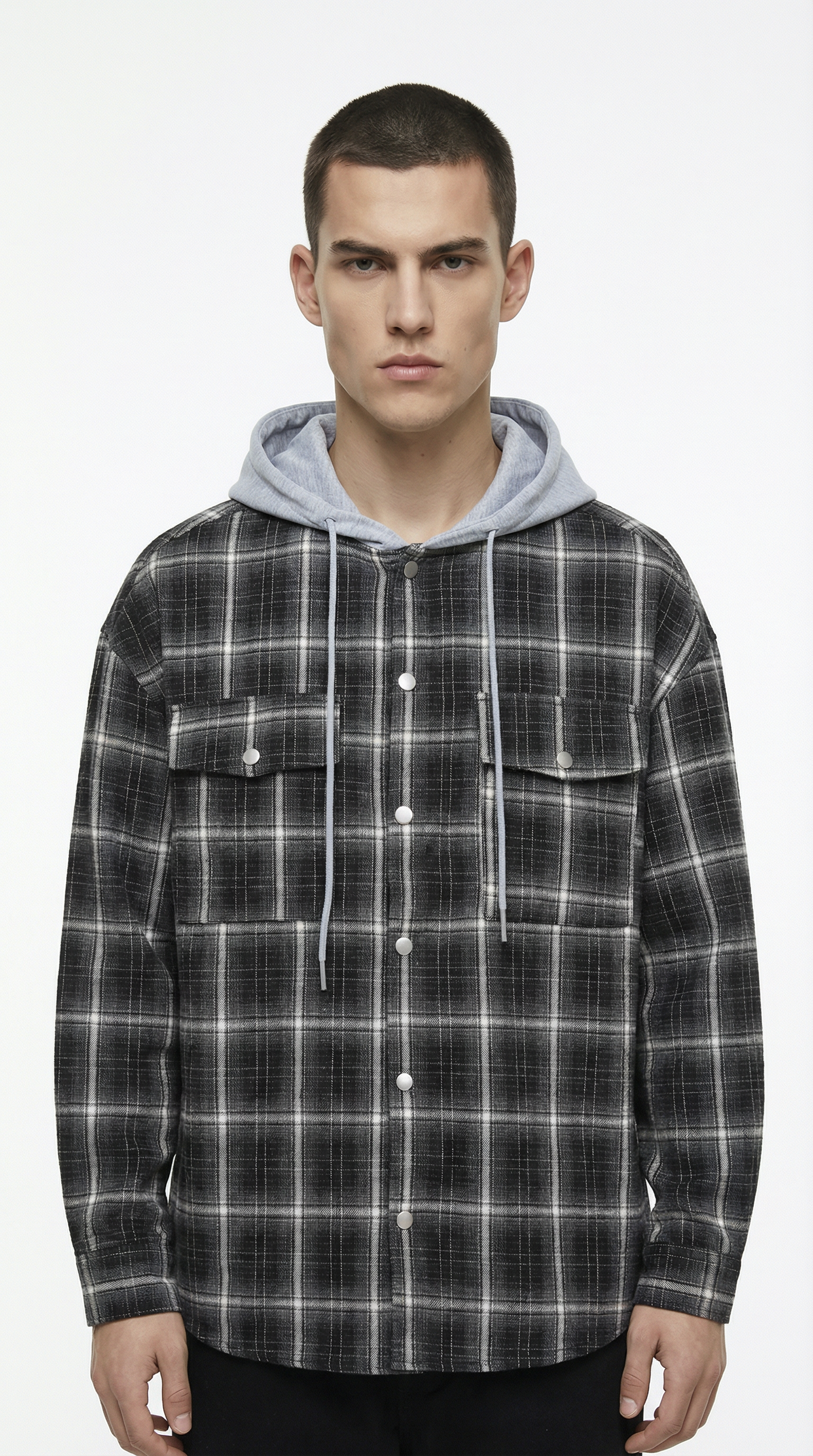 Man wearing a plaid shirt with a hood on a white background