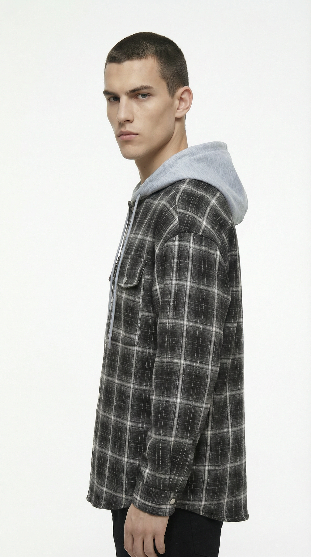 Person wearing a plaid shirt with a hood on a white background