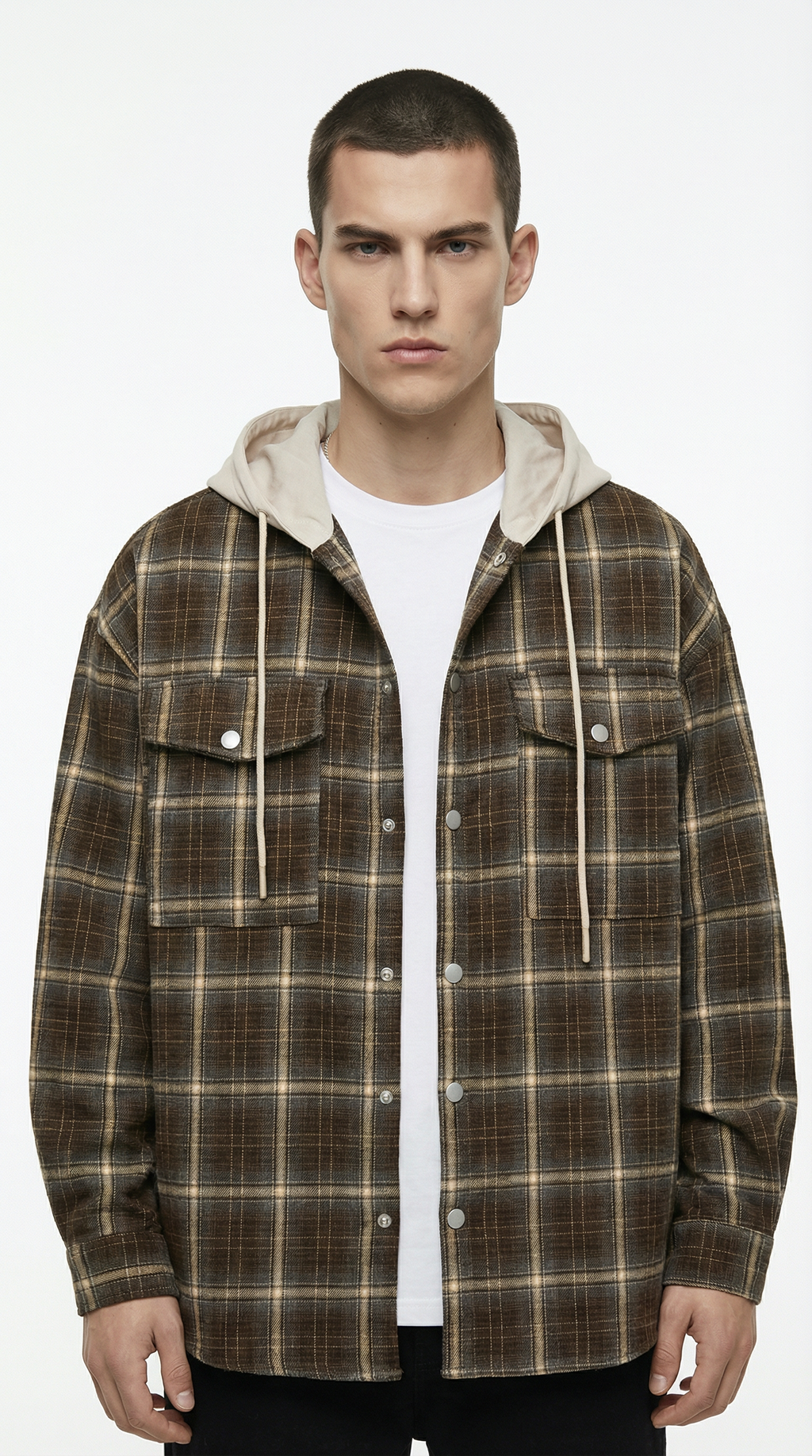 Man wearing a plaid jacket with a white shirt underneath on a white background