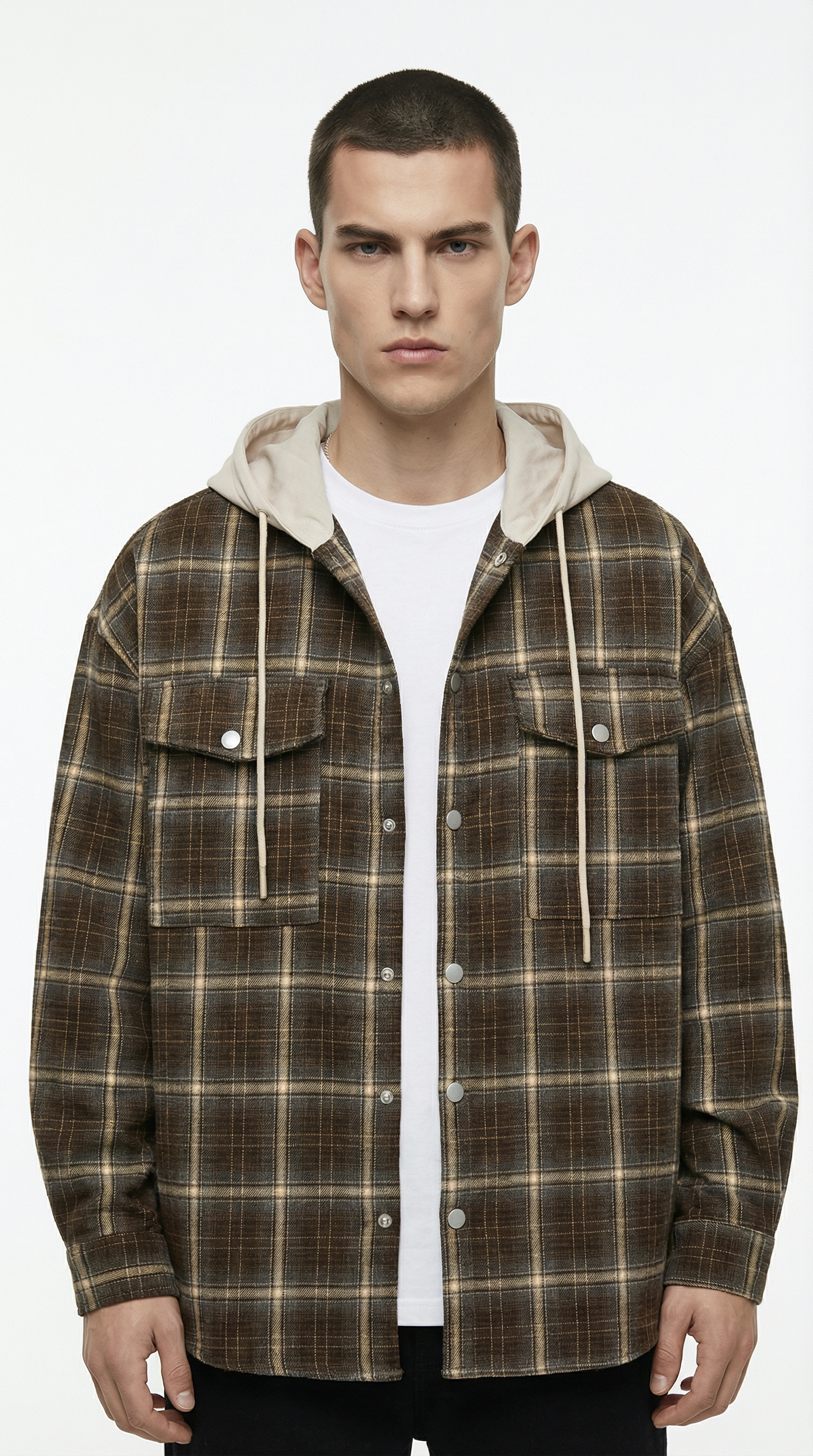 Man wearing a plaid jacket with a white shirt underneath on a white background