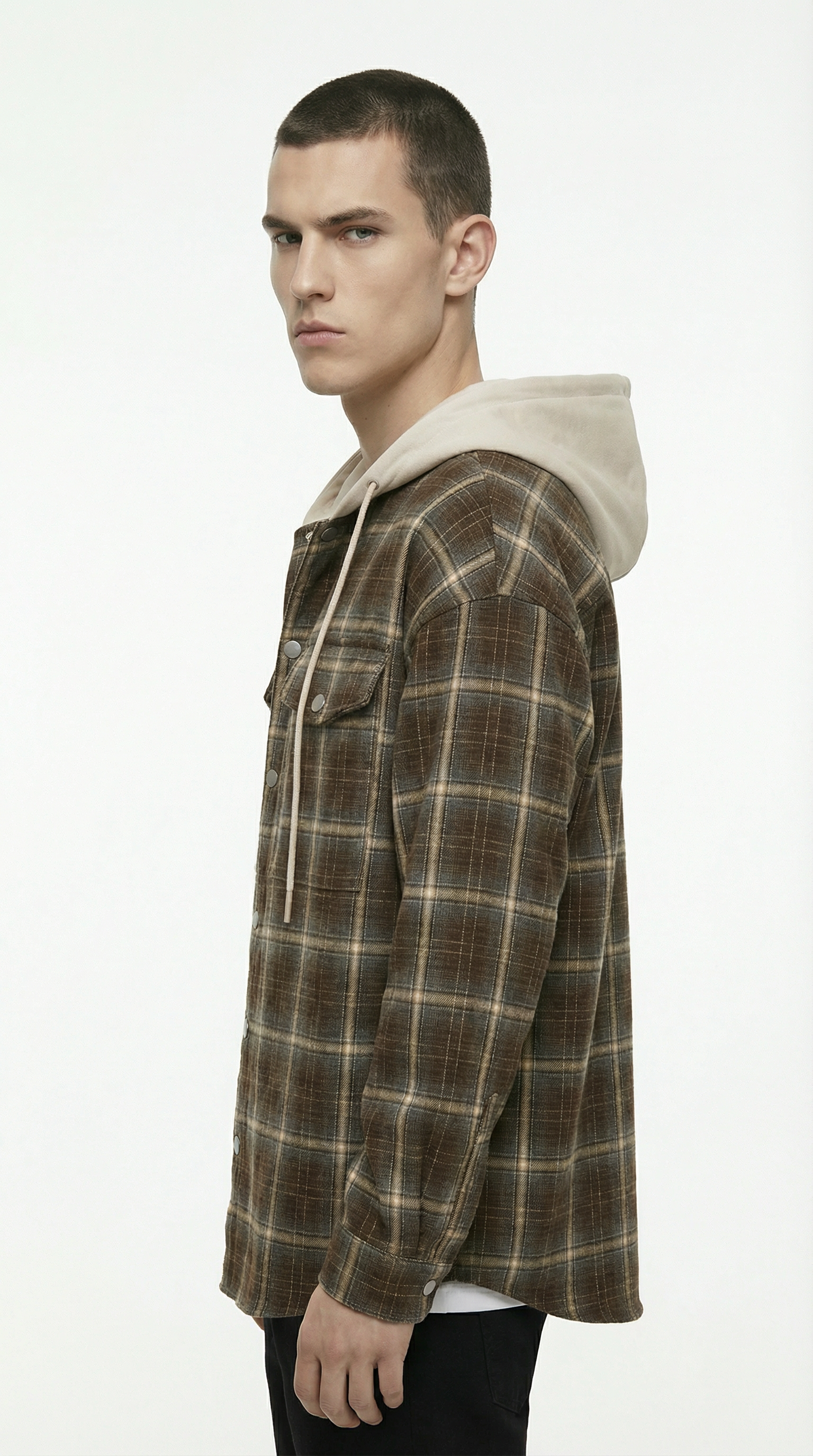 Man wearing a plaid shirt with a hood on a white background