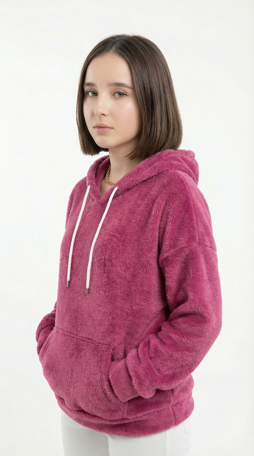 Person wearing a pink hoodie on a white background