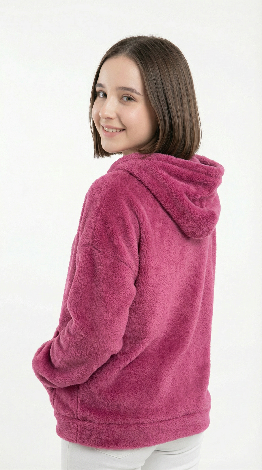 Young girl wearing a pink fleece hoodie on a white background