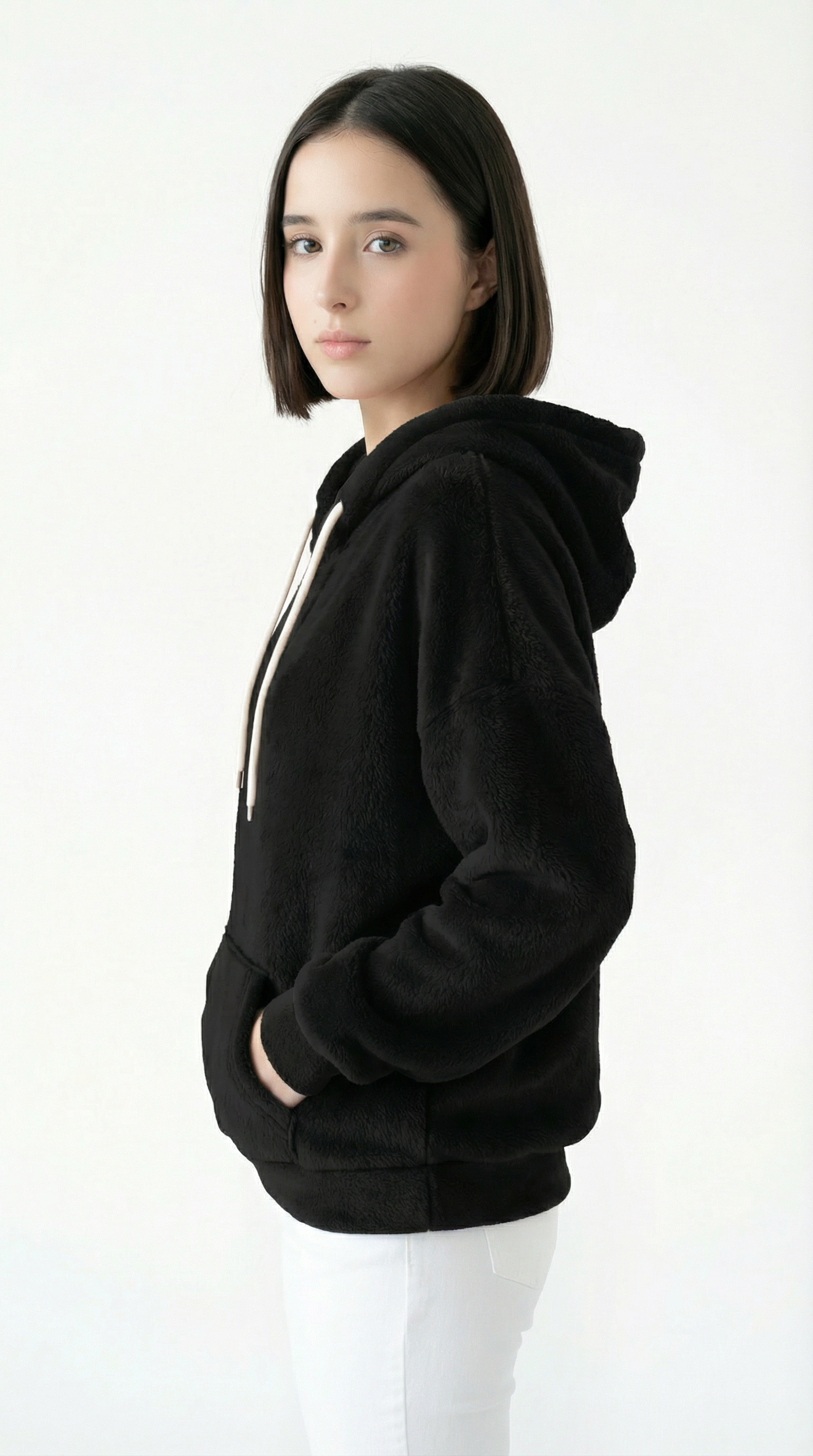 Person wearing a black hoodie on a white background