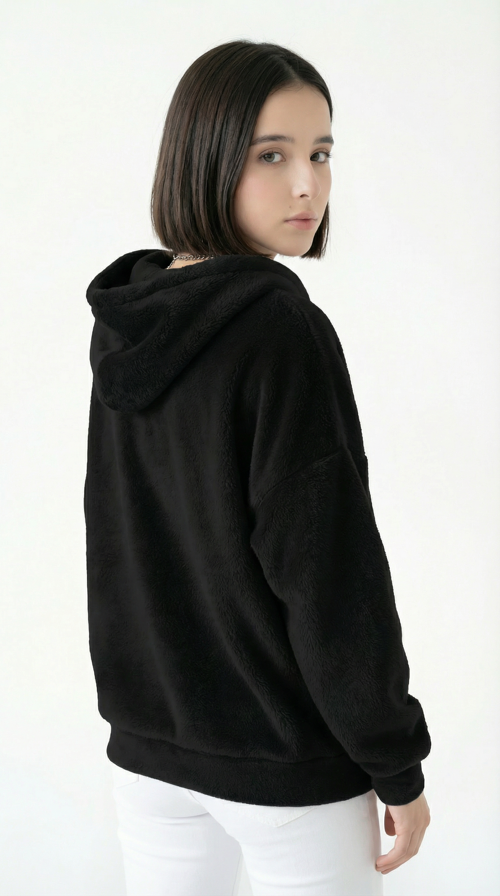 Person wearing a black hoodie on a white background