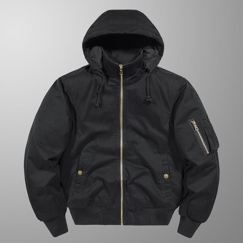 Black hooded jacket with gold zipper on a gray background