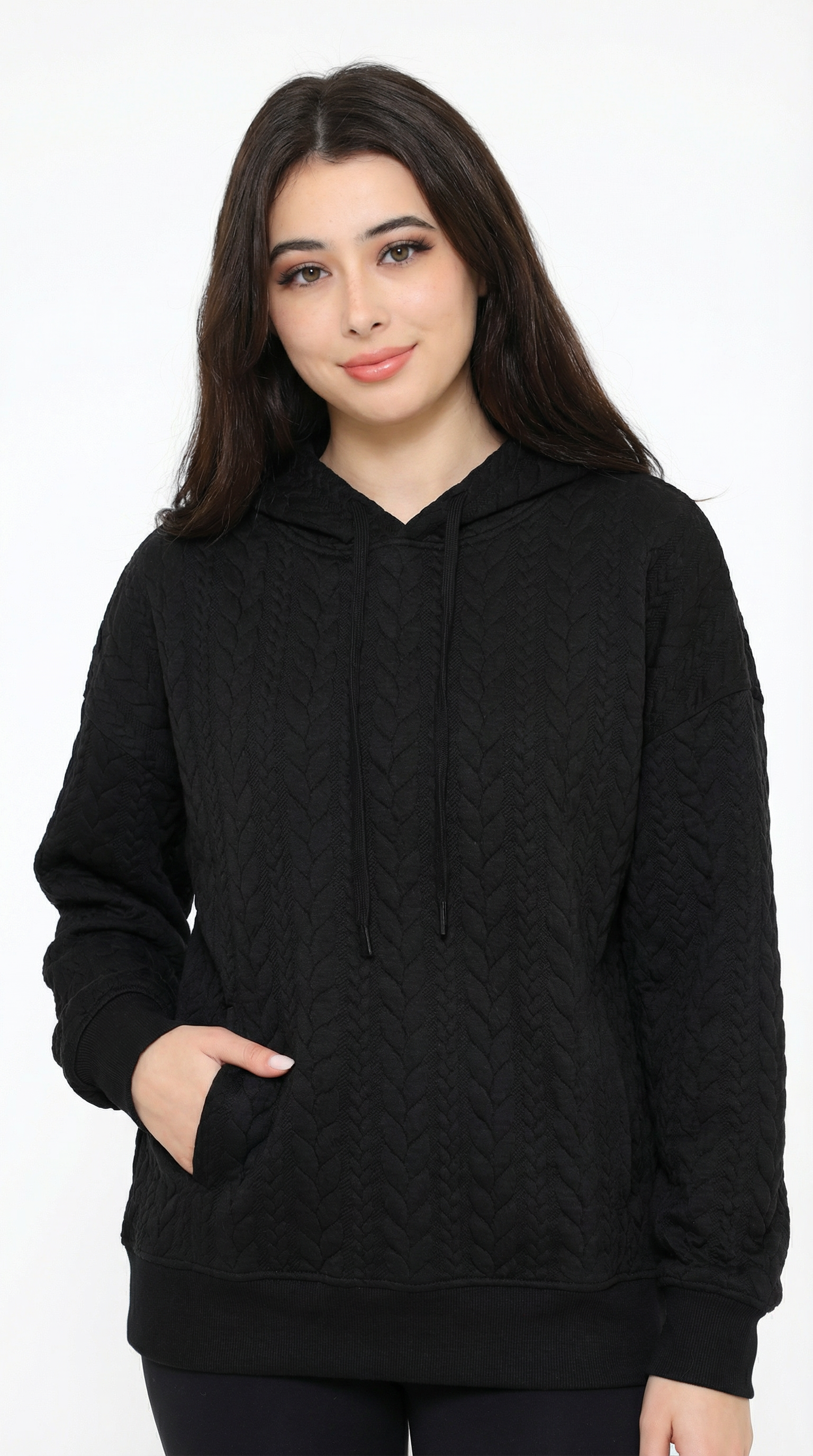 Woman wearing a black hoodie on a white background