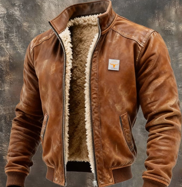 Brown leather jacket with fur lining on a textured gray background