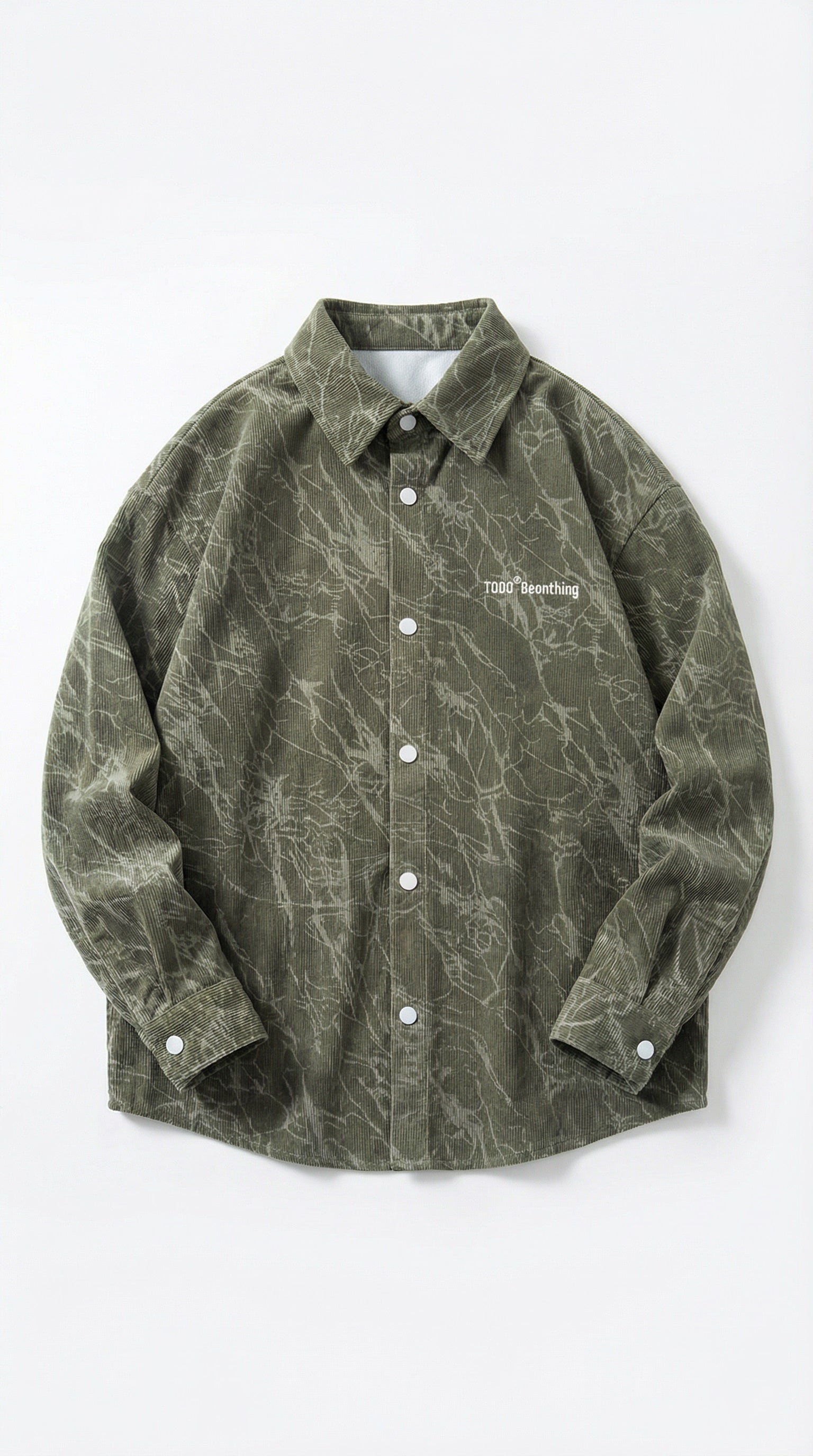 Green patterned shirt on a white background