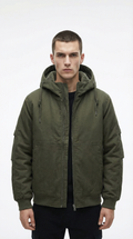 Man wearing a green hooded jacket from Meleche or Meléche (short as (Mé))