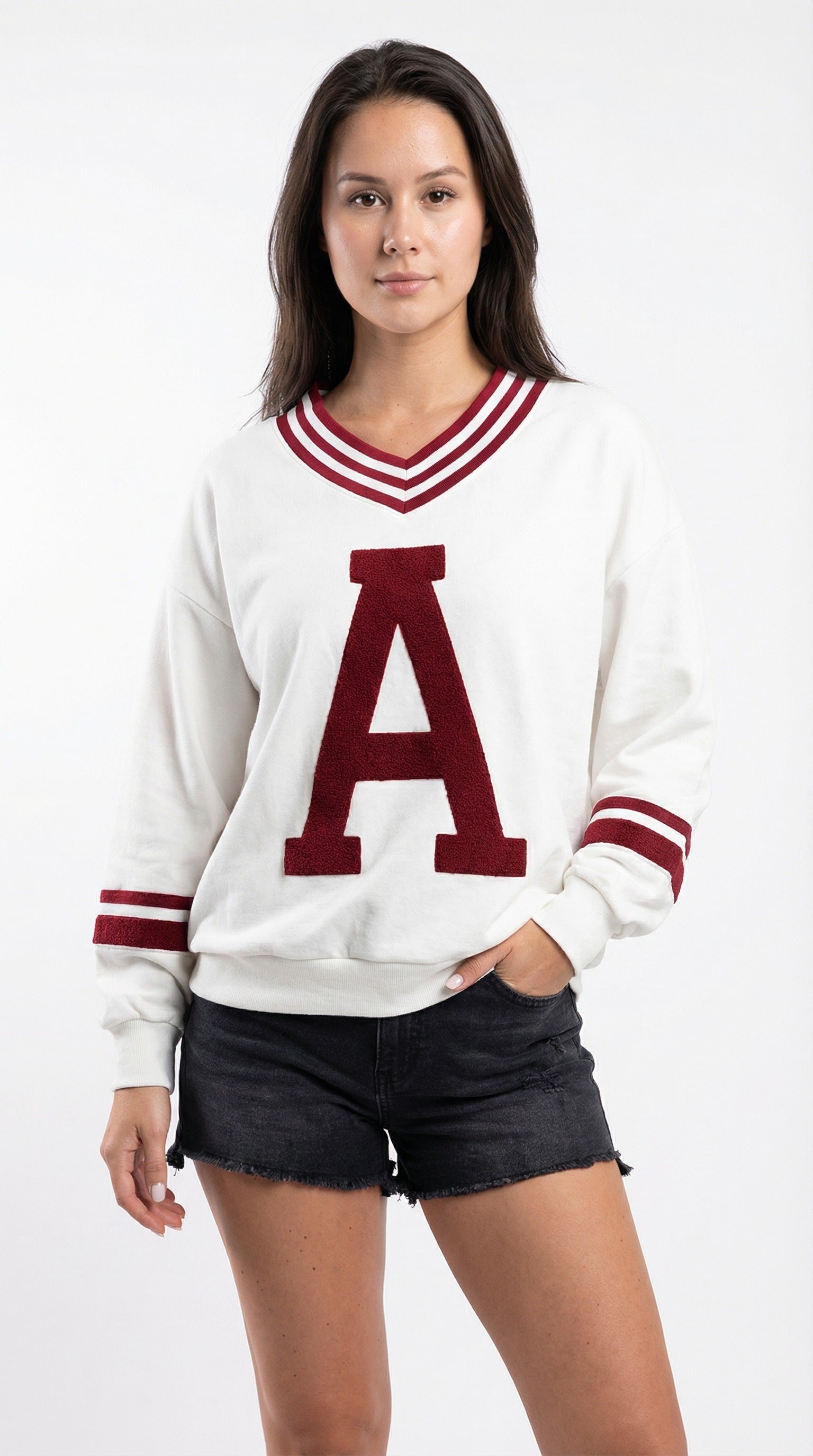Person wearing a white sweater with a red 'A' and black shorts from Meleche or Meléche (short as (Mé))