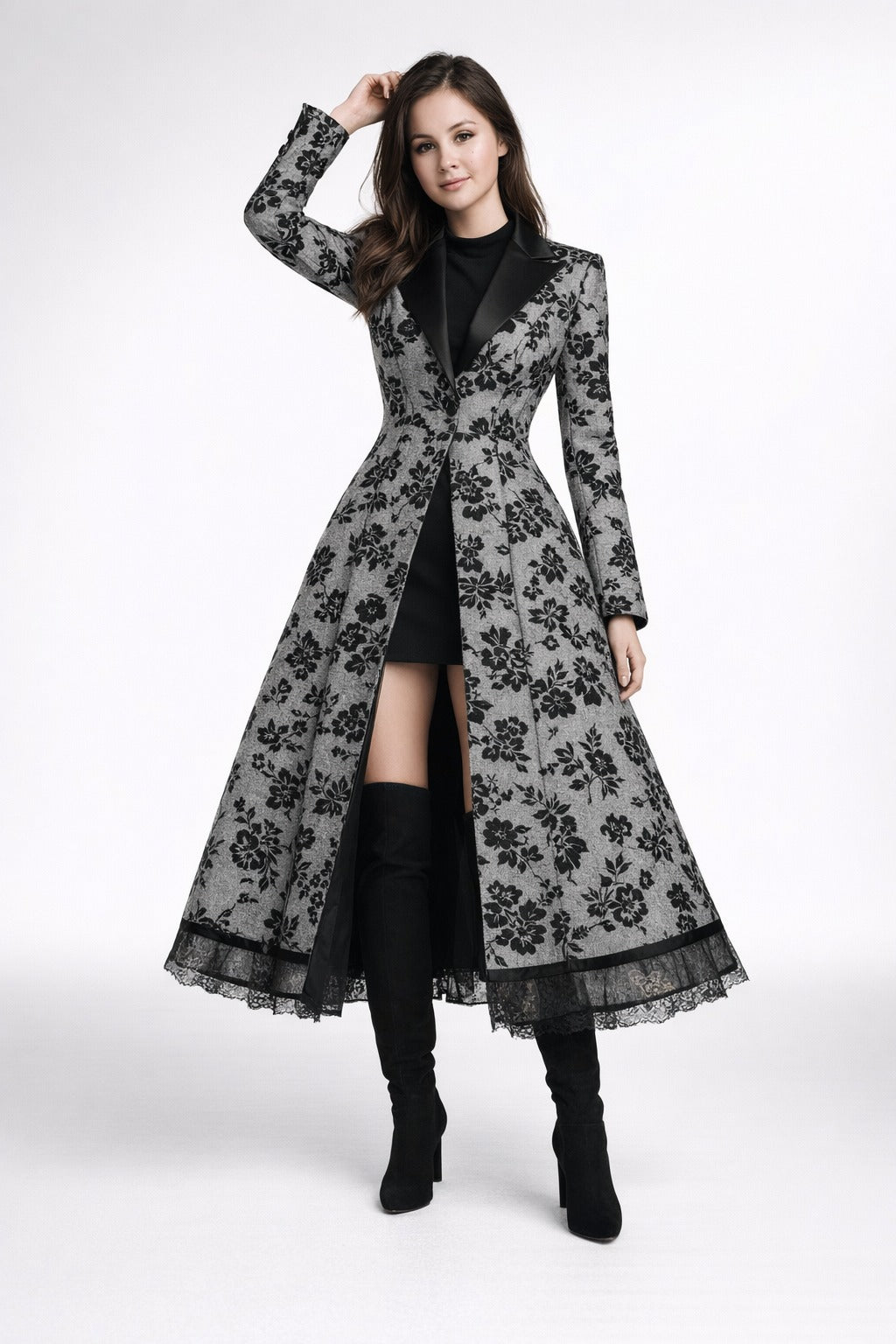 Mia Gray wearing a long black floral lace coat  Eden dress from Meleche or Meléche (short as (Mé))on a white background