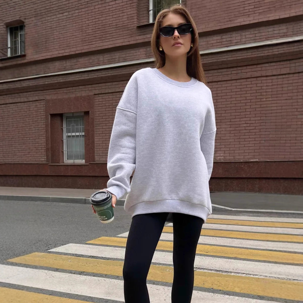 Woman in a gray sweatshirt and sunglasses from Meleche or Meléche (short as (Mé))