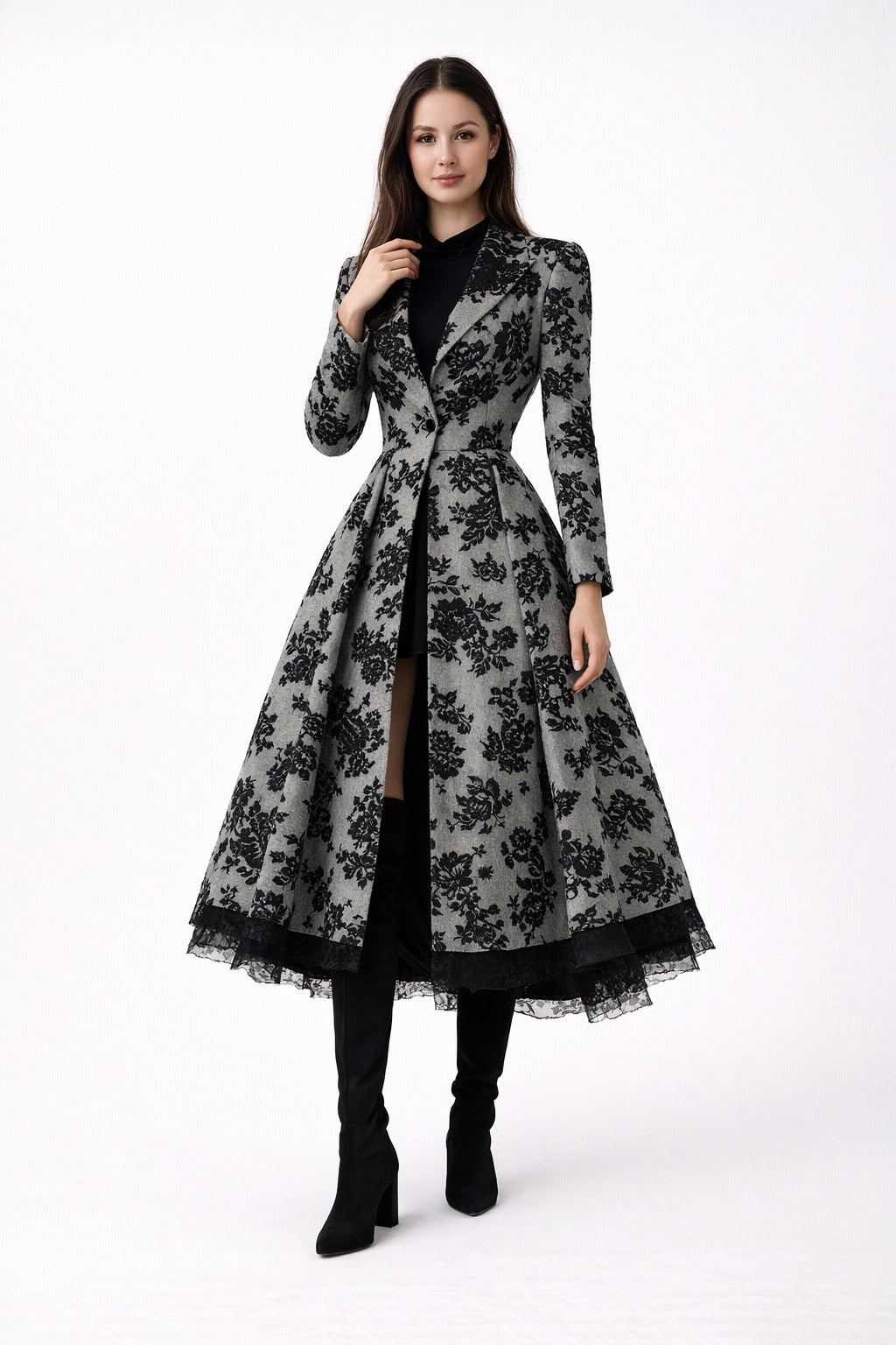 Mia Gray wearing a long, floral-patterned coat Eden dress from Meleche or Meléche (short as (Mé)) on a white background