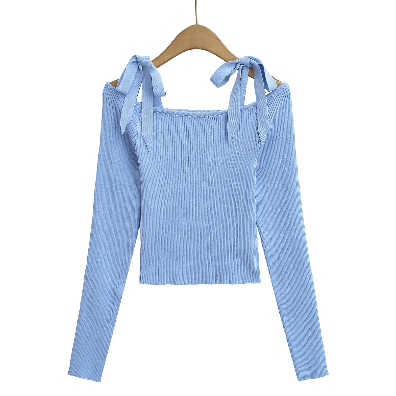 Light blue ribbed sweater with bow straps on a hanger from Meleche or Meléche (short as (Mé))