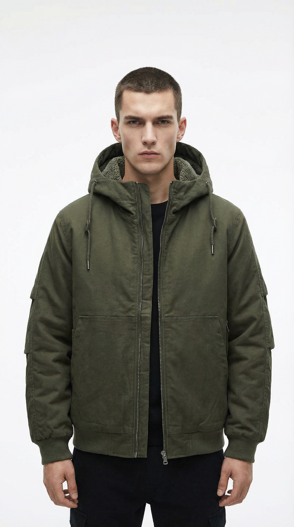 Man wearing a green hooded jacket on a white background