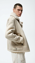 Man wearing a beige shearling jacket from Meleche or Meléche (short as (Mé))