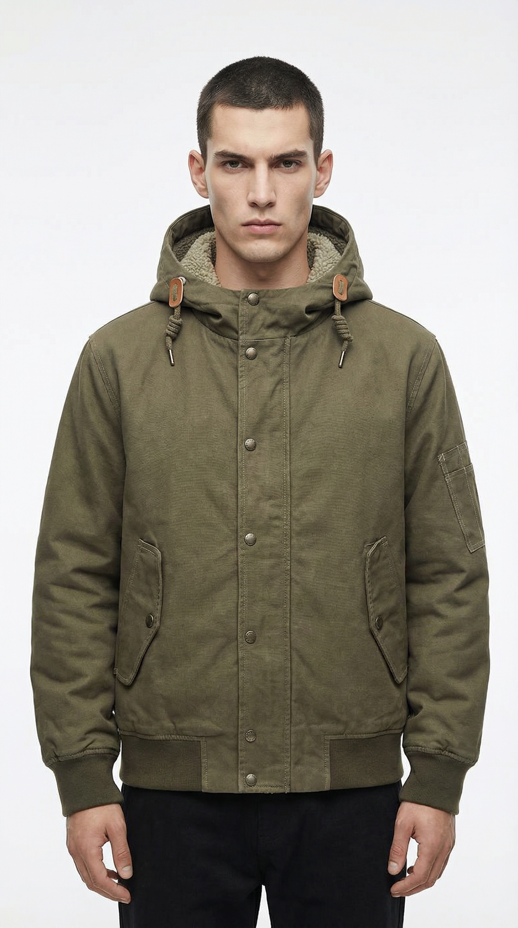 Man wearing a green hooded jacket from Meleche or Meléche (short as (Mé))