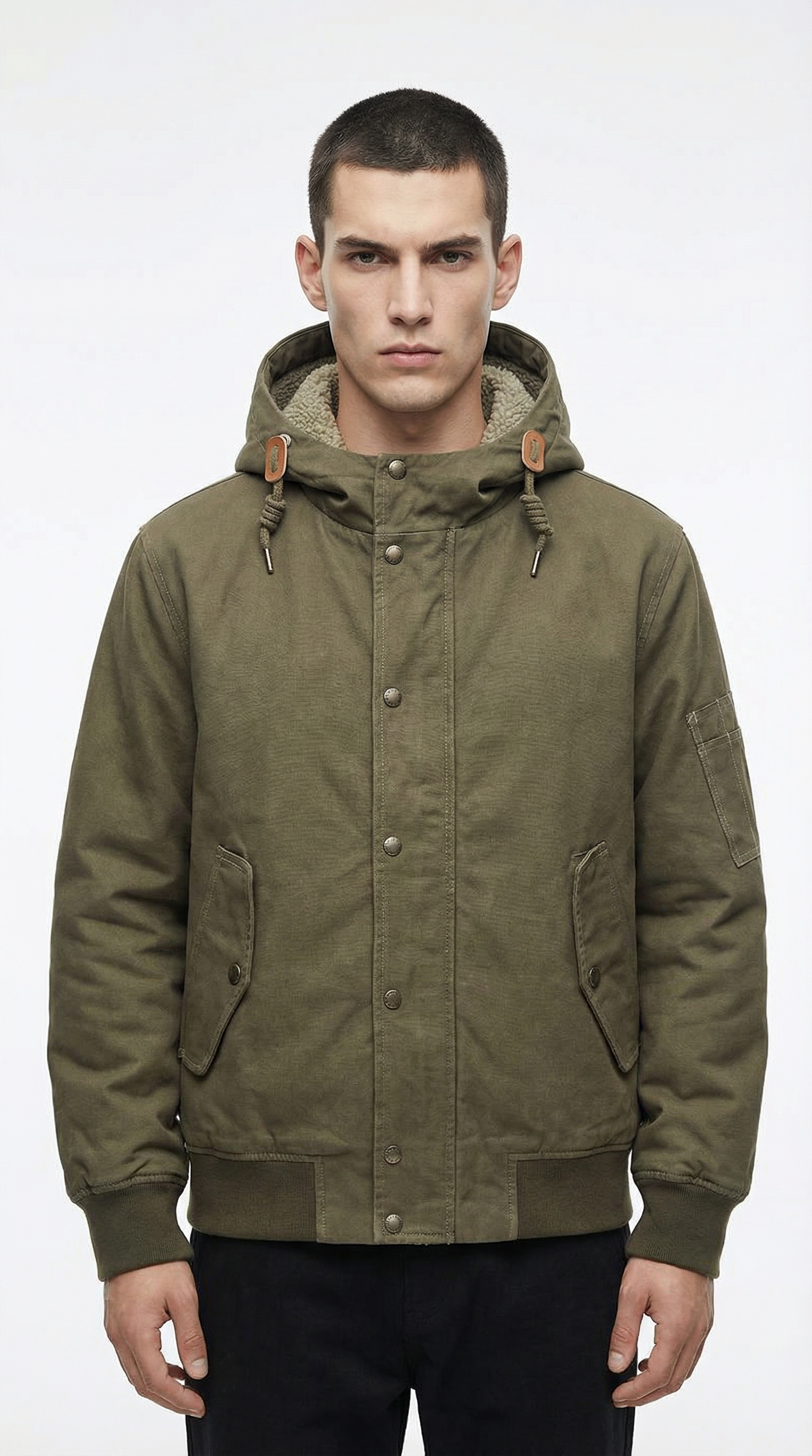 Man wearing a green hooded jacket from Meleche or Meléche (short as (Mé))