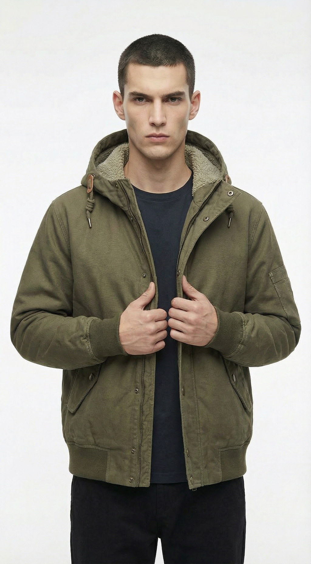 Man wearing a green hooded jacket from Meleche or Meléche (short as (Mé))